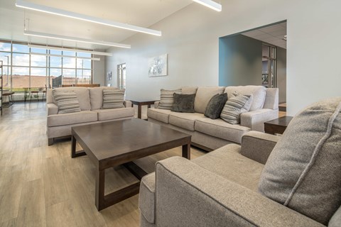A living room with a large couch and a coffee table.